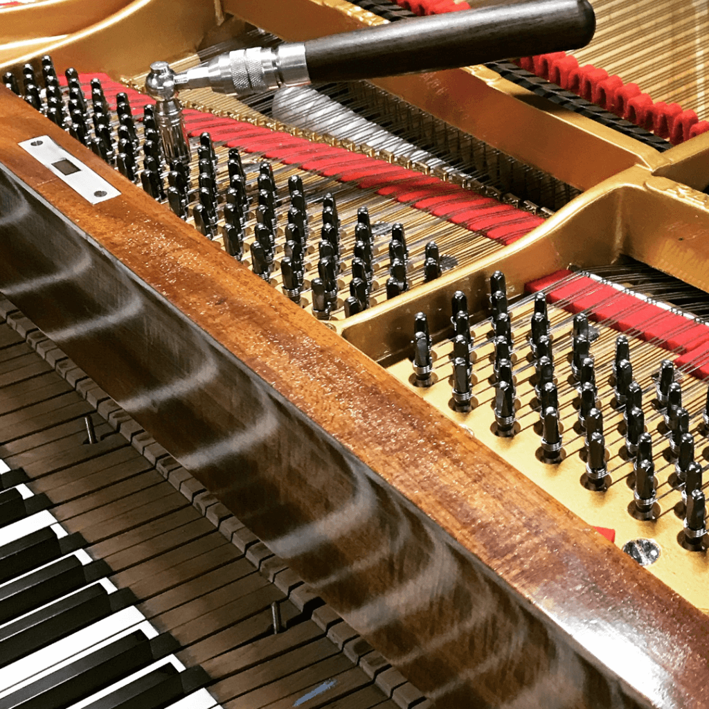 An Image Of Tuning A Grand Piano Put On By Emrich Piano Service